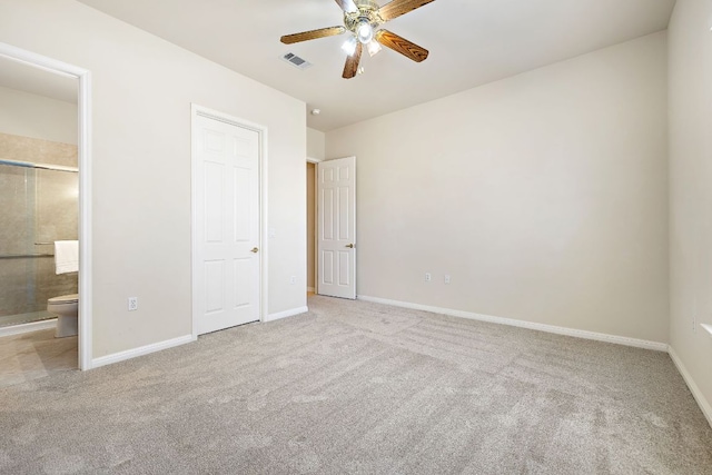 unfurnished bedroom featuring carpet flooring, visible vents, baseboards, and ensuite bathroom