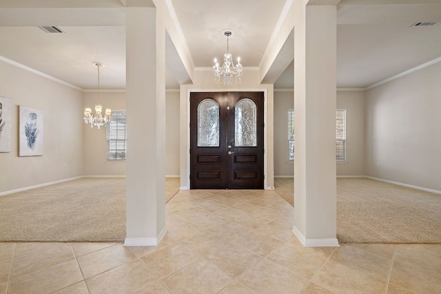 entryway with light colored carpet, visible vents, and an inviting chandelier