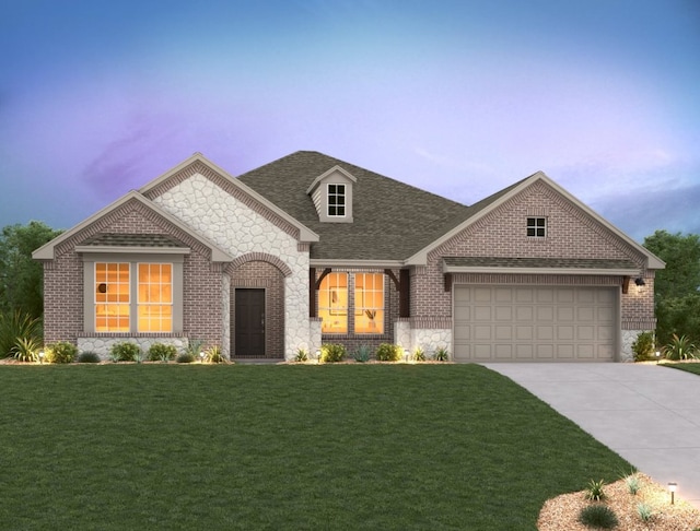 view of front facade featuring an attached garage, brick siding, a shingled roof, driveway, and a lawn