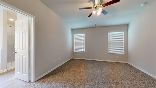 unfurnished room featuring ceiling fan, baseboards, and light colored carpet