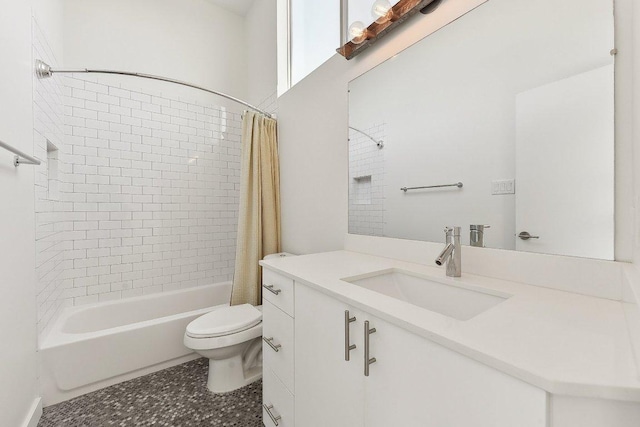 bathroom featuring vanity, toilet, and shower / bathtub combination with curtain