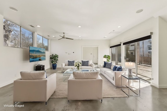 living room with recessed lighting, visible vents, baseboards, and concrete floors