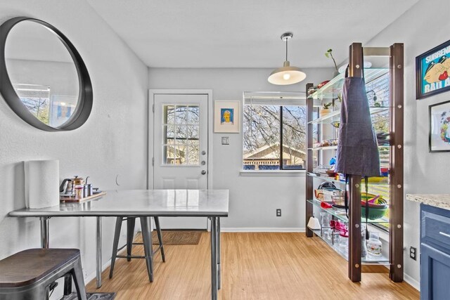 office space featuring light wood-style flooring and baseboards