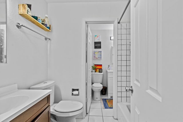 bathroom featuring shower / washtub combination, tile patterned flooring, vanity, and toilet