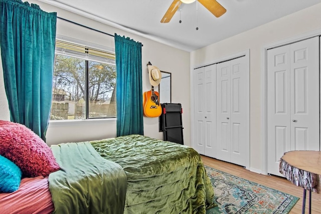 bedroom with a ceiling fan and wood finished floors