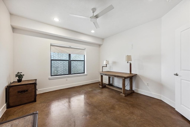 interior space with concrete flooring, recessed lighting, ceiling fan, and baseboards