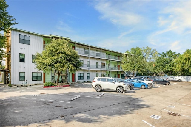 view of property with uncovered parking