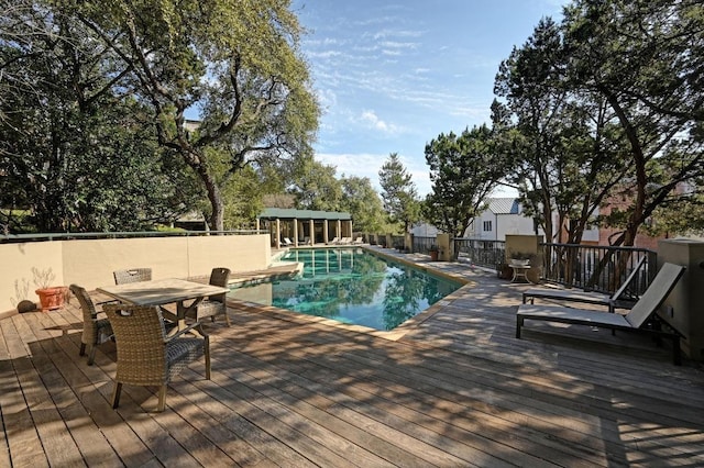 1707 Spyglass Dr Unit 74, Austin, TX 78746 - view of swimming pool with a wooden deck and outdoor dining area