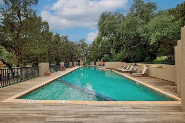 pool with a wooden deck