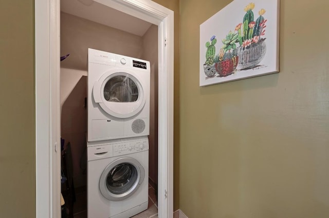 laundry area featuring laundry area and stacked washer and clothes dryer