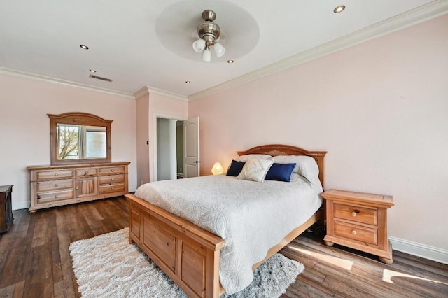 bedroom featuring dark wood-type flooring, recessed lighting, crown molding, and baseboards