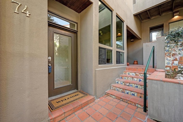 entrance to property with stucco siding