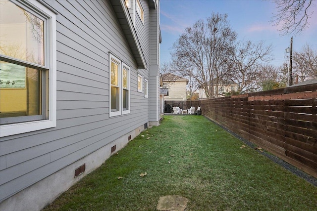 view of yard with a fenced backyard