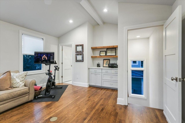 workout area featuring vaulted ceiling, recessed lighting, dark wood finished floors, and baseboards