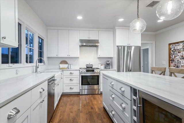 kitchen with wine cooler, stainless steel appliances, visible vents, a sink, and under cabinet range hood