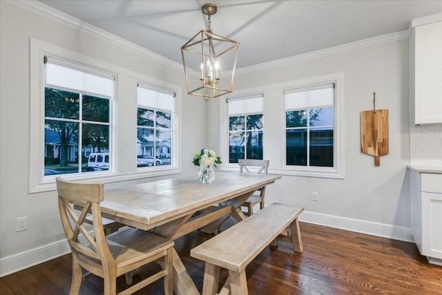 dining area with dark wood-style floors, plenty of natural light, ornamental molding, and baseboards