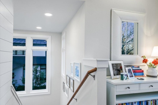 interior space featuring an upstairs landing and recessed lighting