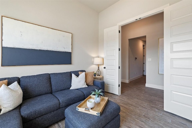 living room with wood finished floors and baseboards