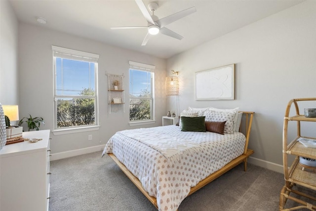 bedroom with a ceiling fan, carpet, and baseboards