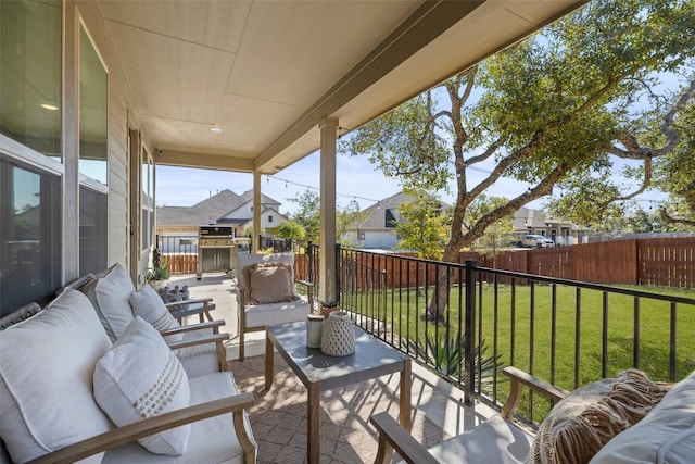 balcony with a residential view and an outdoor living space