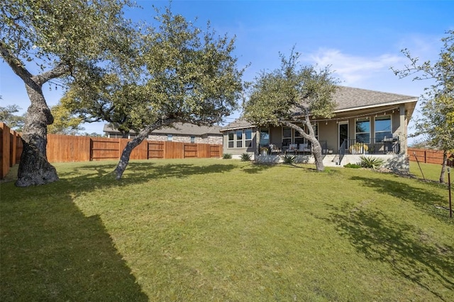 view of yard featuring a fenced backyard