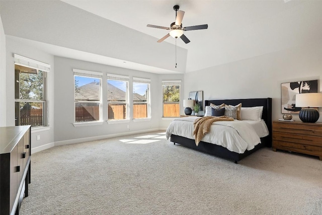 bedroom with carpet, ceiling fan, lofted ceiling, and baseboards