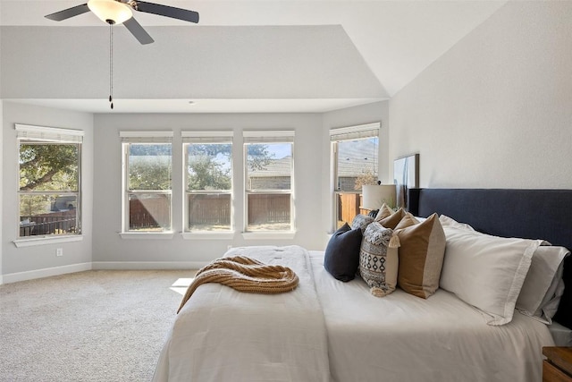 bedroom with carpet floors, ceiling fan, baseboards, and vaulted ceiling