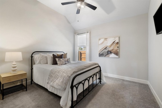 bedroom with vaulted ceiling, carpet floors, ceiling fan, and baseboards