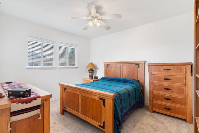 bedroom featuring ceiling fan and light colored carpet