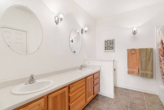 bathroom with tile patterned flooring, a sink, curtained shower, and double vanity