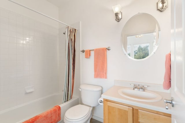 bathroom featuring shower / bath combination with curtain, vanity, and toilet