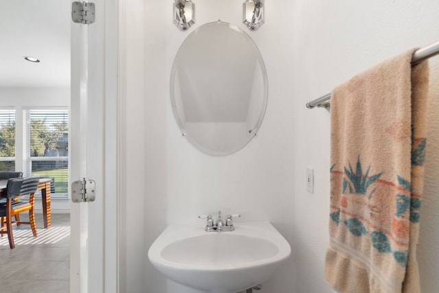 bathroom with recessed lighting, a sink, and tile patterned floors