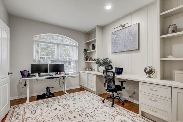 18712 Deep Water Dr, Pflugerville, TX 78660 - office area featuring built in study area, wood finished floors, built in features, and baseboards