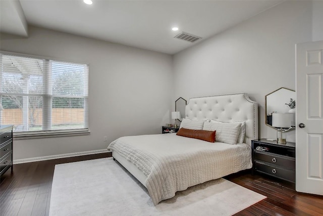 bedroom featuring dark wood-style floors, baseboards, visible vents, and recessed lighting