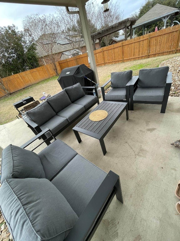 view of patio with a fenced backyard and outdoor lounge area