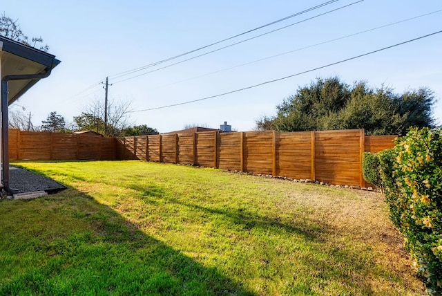 view of yard with a fenced backyard