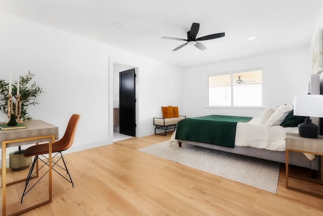 bedroom featuring light wood-style flooring and baseboards