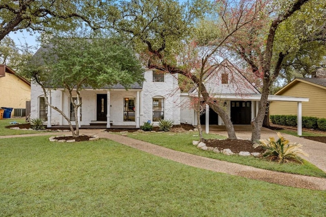 view of front of house with central air condition unit, covered porch, a garage, and a front yard