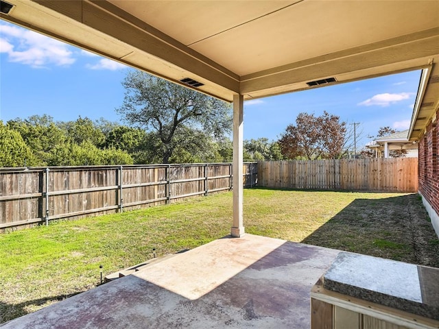 view of patio with a fenced backyard and visible vents