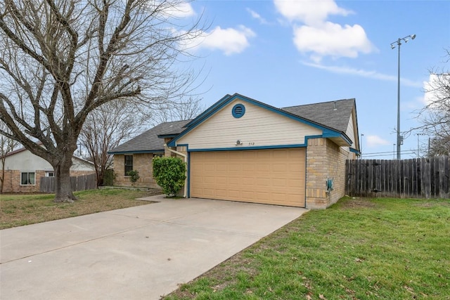 view of front facade with concrete driveway, stone siding, an attached garage, fence, and a front yard