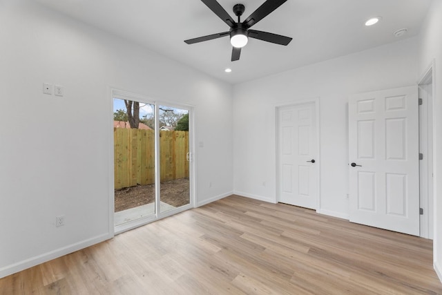 unfurnished bedroom featuring baseboards, access to outside, recessed lighting, and light wood-style floors