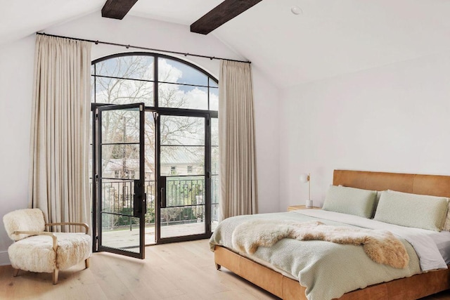 bedroom featuring light wood-type flooring, access to outside, and lofted ceiling with beams