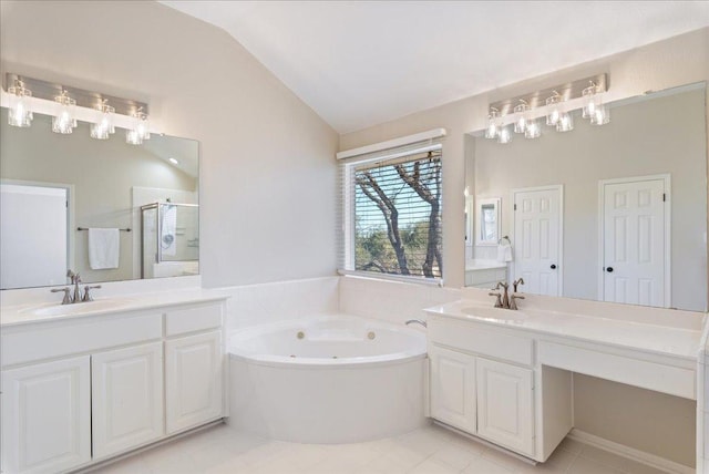 full bath featuring lofted ceiling, two vanities, a sink, a shower stall, and a tub with jets