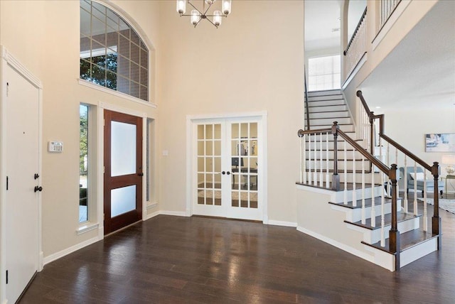 entryway with french doors, wood finished floors, and a wealth of natural light