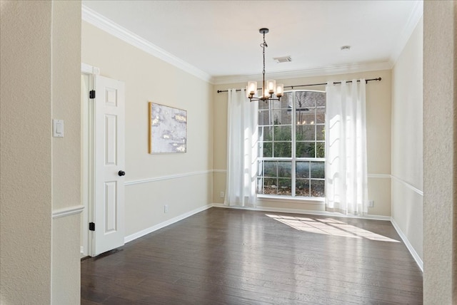 unfurnished dining area with dark wood-style flooring, an inviting chandelier, visible vents, and crown molding