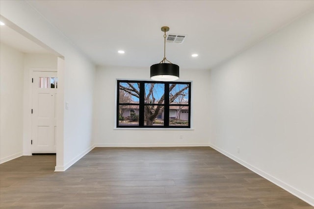 unfurnished dining area featuring recessed lighting, wood finished floors, visible vents, and baseboards