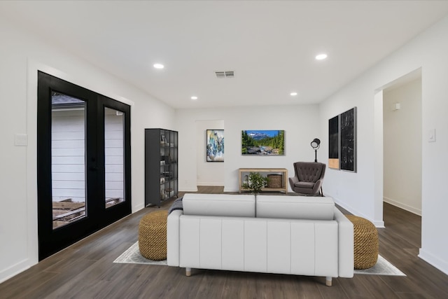 living room with baseboards, visible vents, wood finished floors, french doors, and recessed lighting