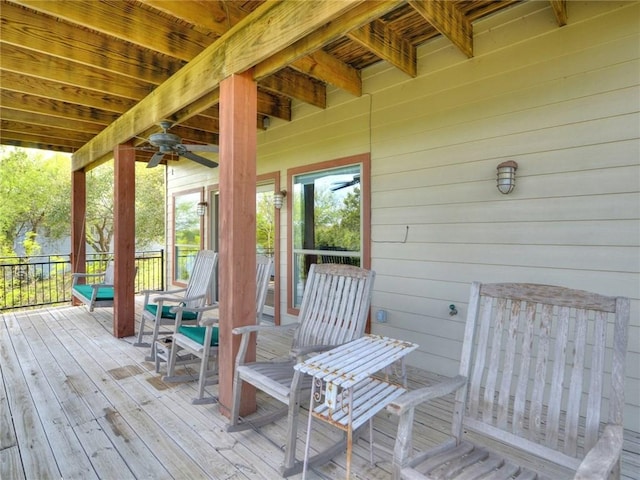 wooden terrace with a ceiling fan