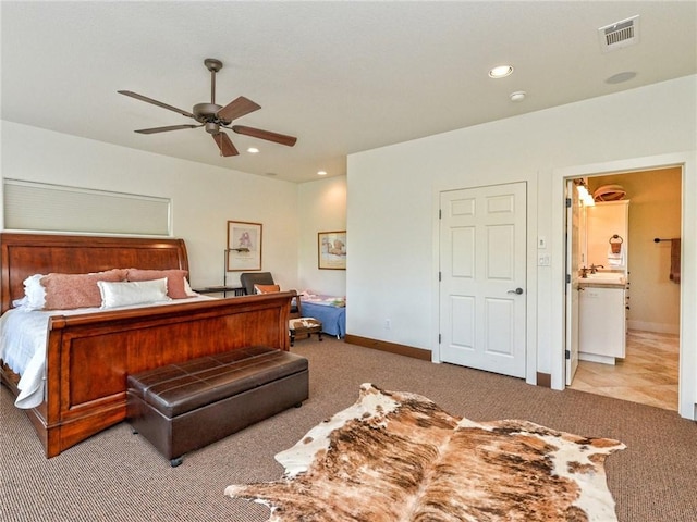 bedroom with carpet, a sink, visible vents, and recessed lighting