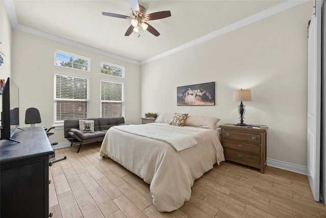 bedroom with a ceiling fan, crown molding, light wood-style flooring, and baseboards